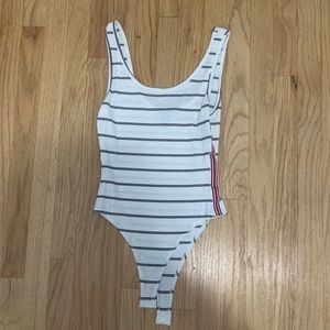White striped body suit with red trim